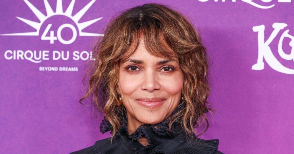 Halle Berry, 58, Flaunts Fit Physique in Black Bathing Suit for Christmas: 'Can't Decide If I Want to Be Naughty or Nice'